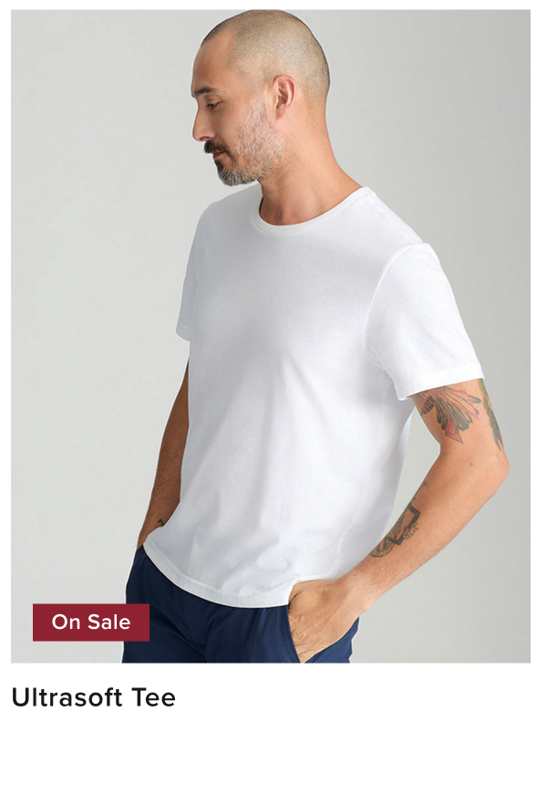 Model is wearing UNTUCKiit ultra soft tee in white. Model is wearing UNTUCKiit ultra soft tee in white.