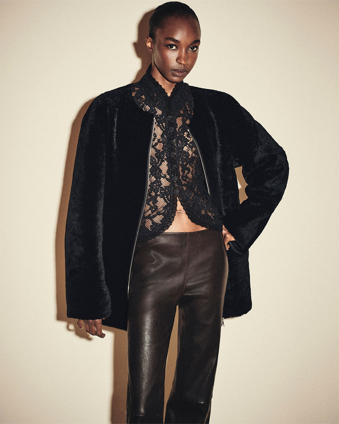 THE COLLARLESS SHEARLING COAT IN BLACK