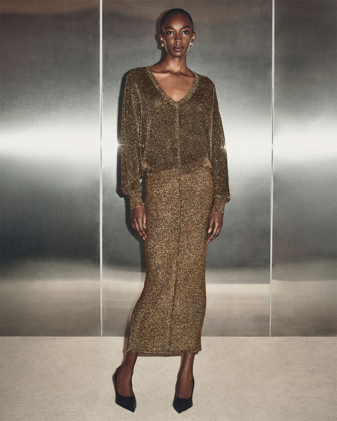 THE LUREX DOLMAN DRESS IN DARK GOLD