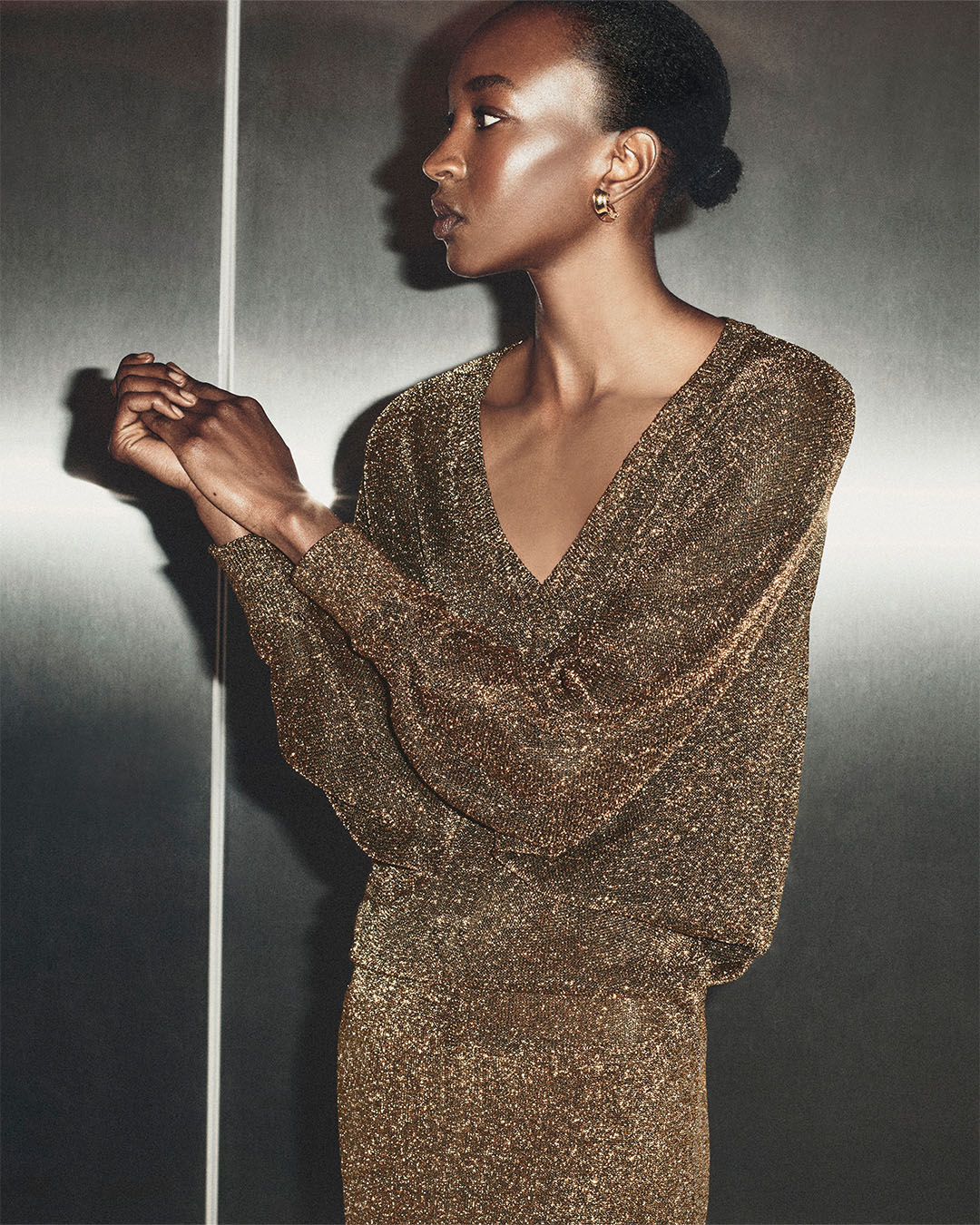 THE LUREX DOLMAN DRESS IN DARK GOLD