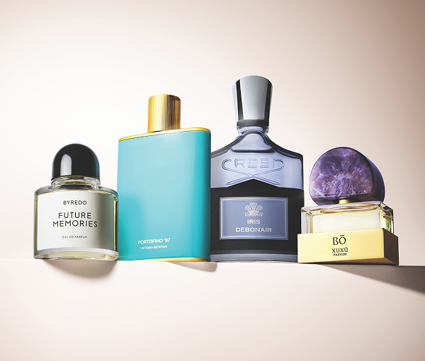 Product shot of assorted fragrance products sitting on a ledge