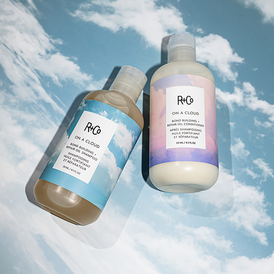 an image of the new r and co on a cloud bond building and repair oil conditioner, along side the shampoo
