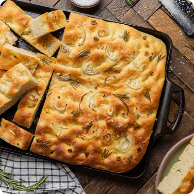 A beautiful focaccia in a cast iron baking pan