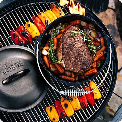 Camp dutch oven on an outdoor grill