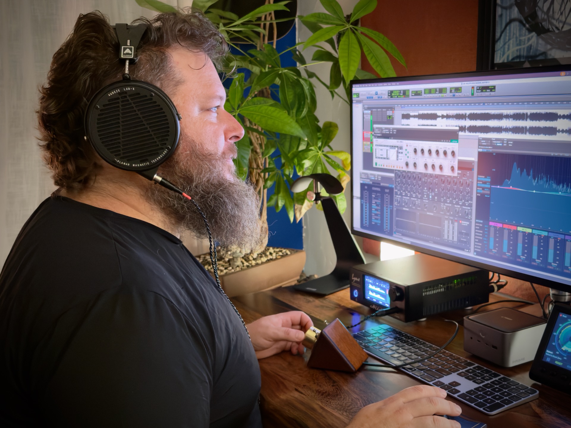 Artist working on a mixing board in studio
