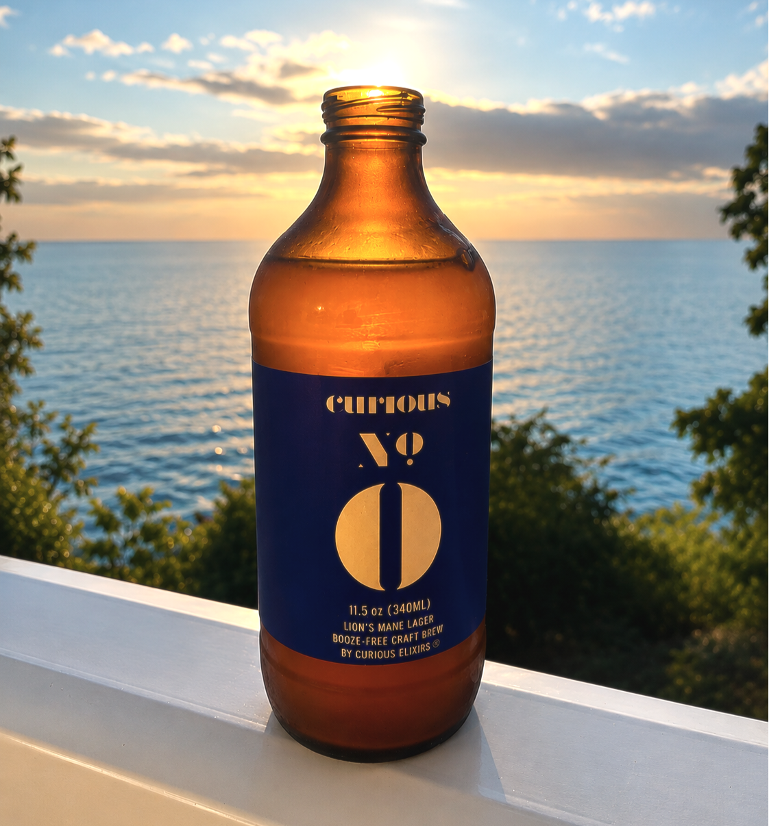 a bottle of Curious Zero sit balcony overlooking the water 