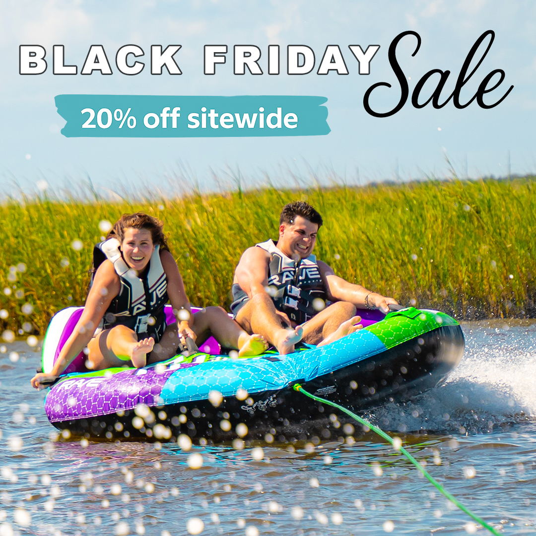 Boys with dog on inflatable floating water mat Aqua Dock